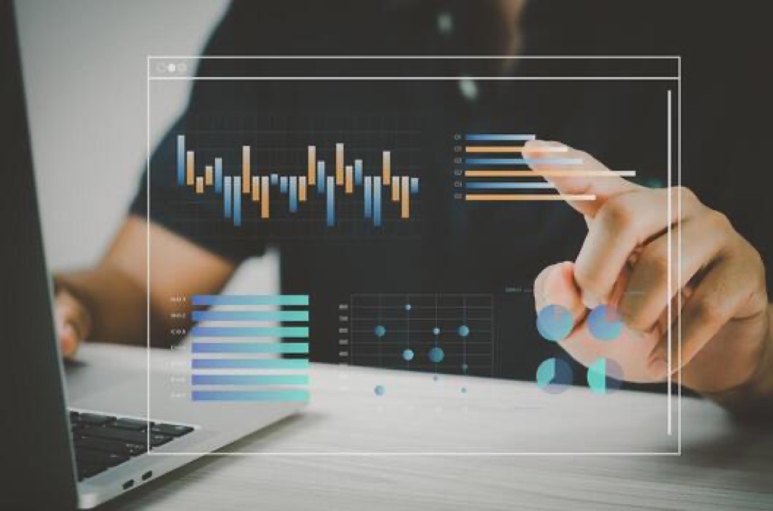 Hand reviewing website analytics and search performance charts