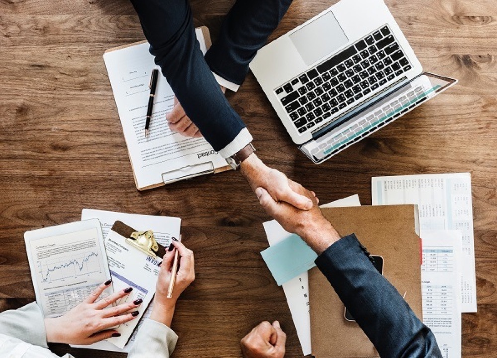 Local business owners meeting and shaking hands