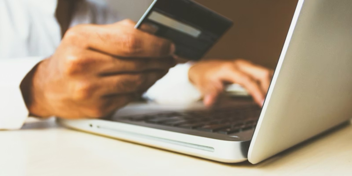 A customer booking and paying online on a laptop